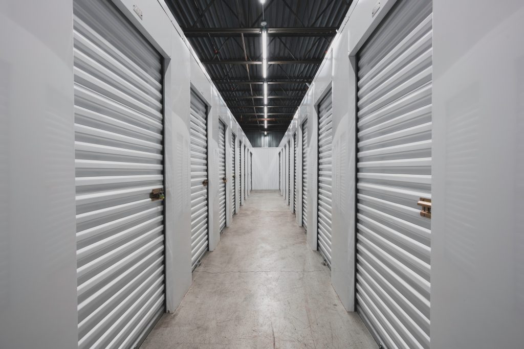 Self storage facility, metal doors with locks. Moving, storage concept.